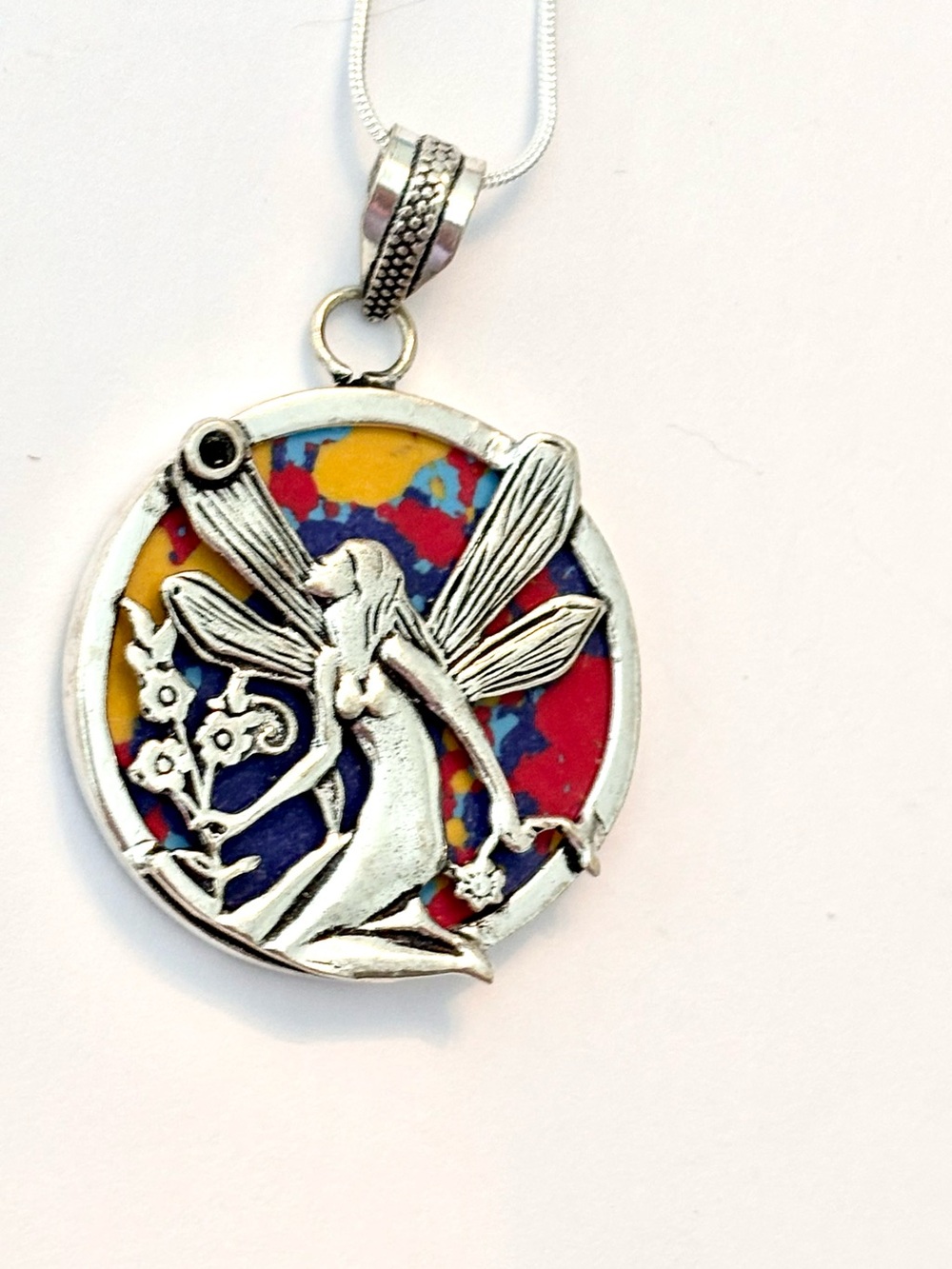 Unique, 2 inch, Mosaic Jasper pendant with silver Fairy on the front.